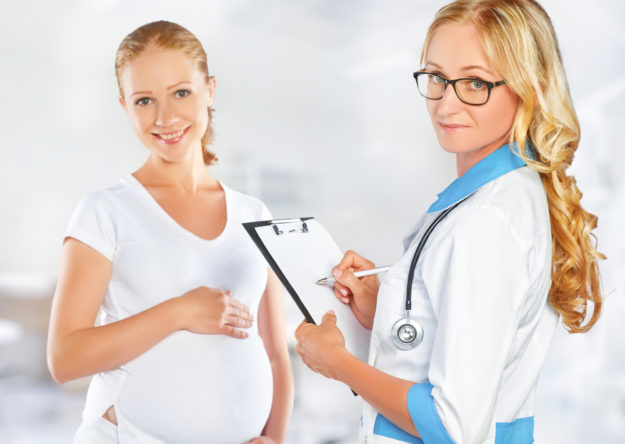 Pregnant woman on reception at doctor